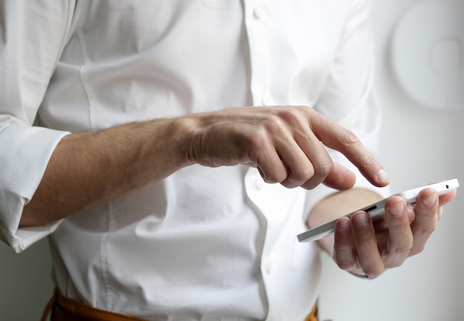 Professional reviewing financial information on a device